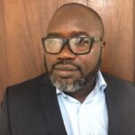 #Kofi Asare Revisits Alma Mater, Distributes Exercise Books to Public Basic Schools